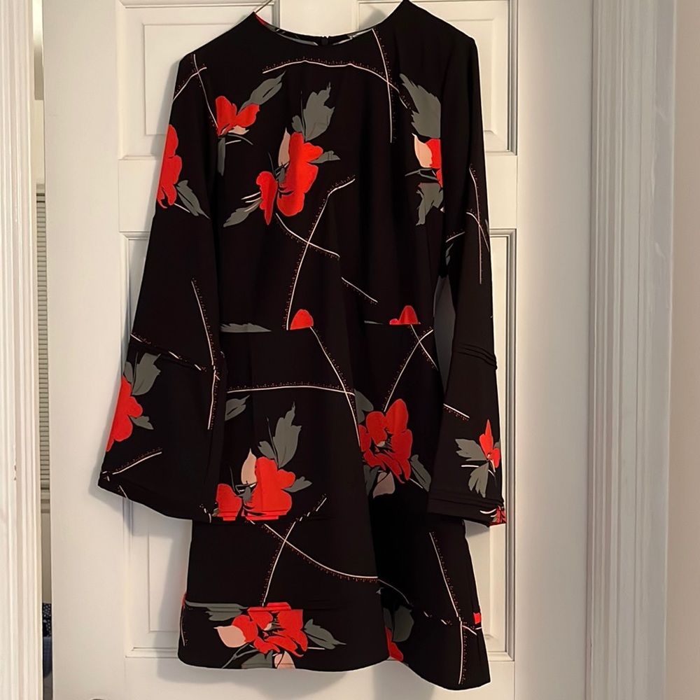 Mini dress with bell sleeves.